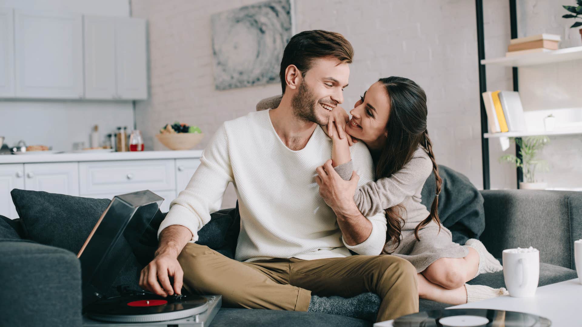 couple hugging on couch