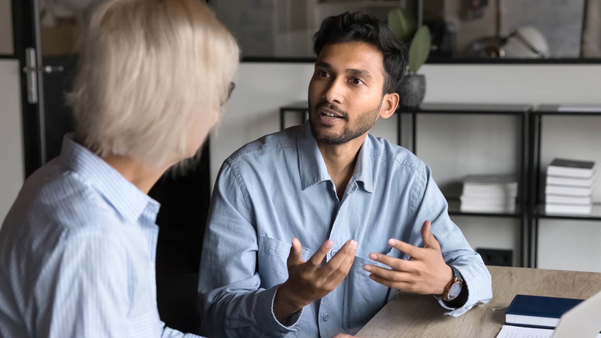 Professional man having a serious discussion with an older woman