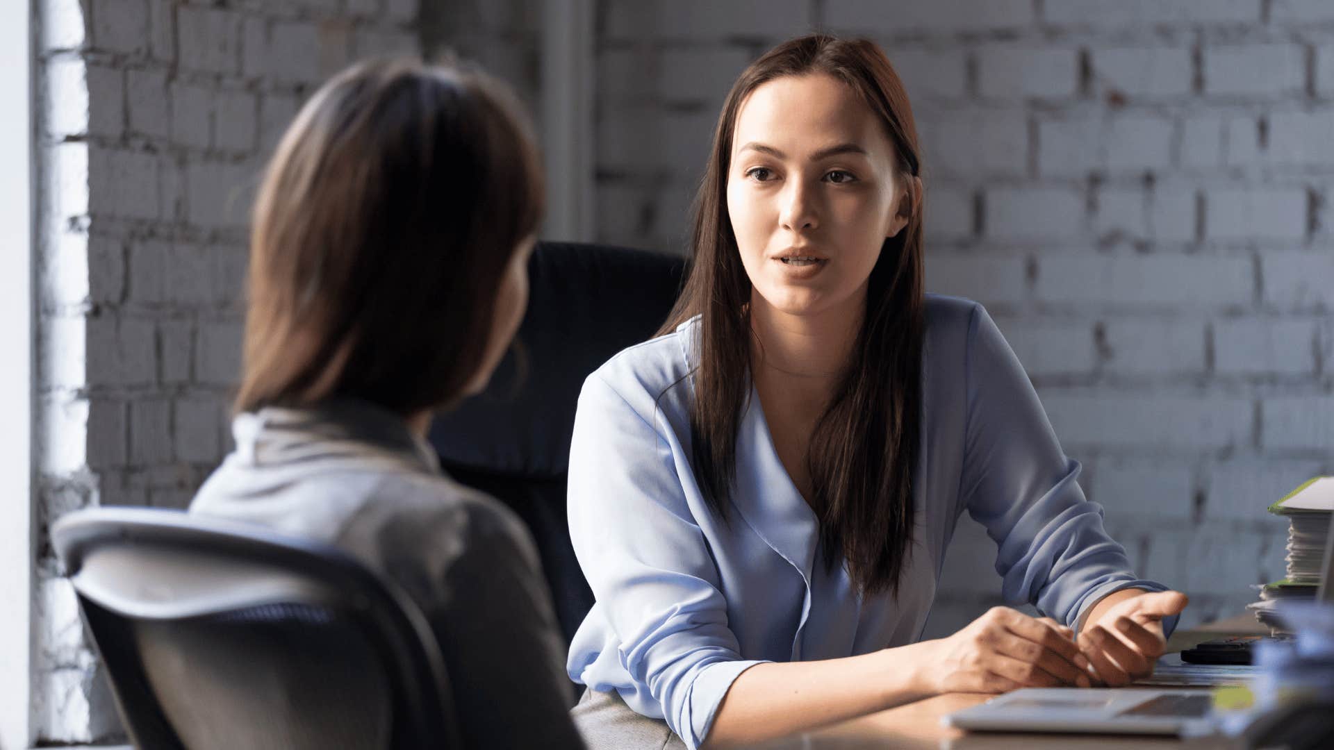 two coworkers talking