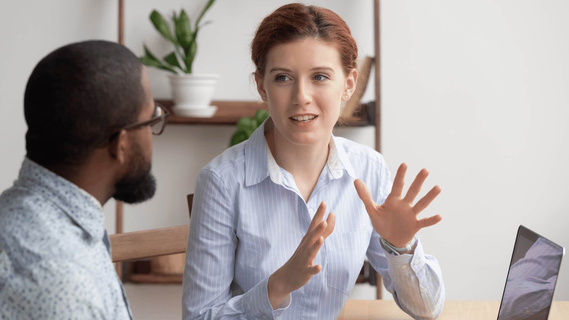 woman talking to coworker 