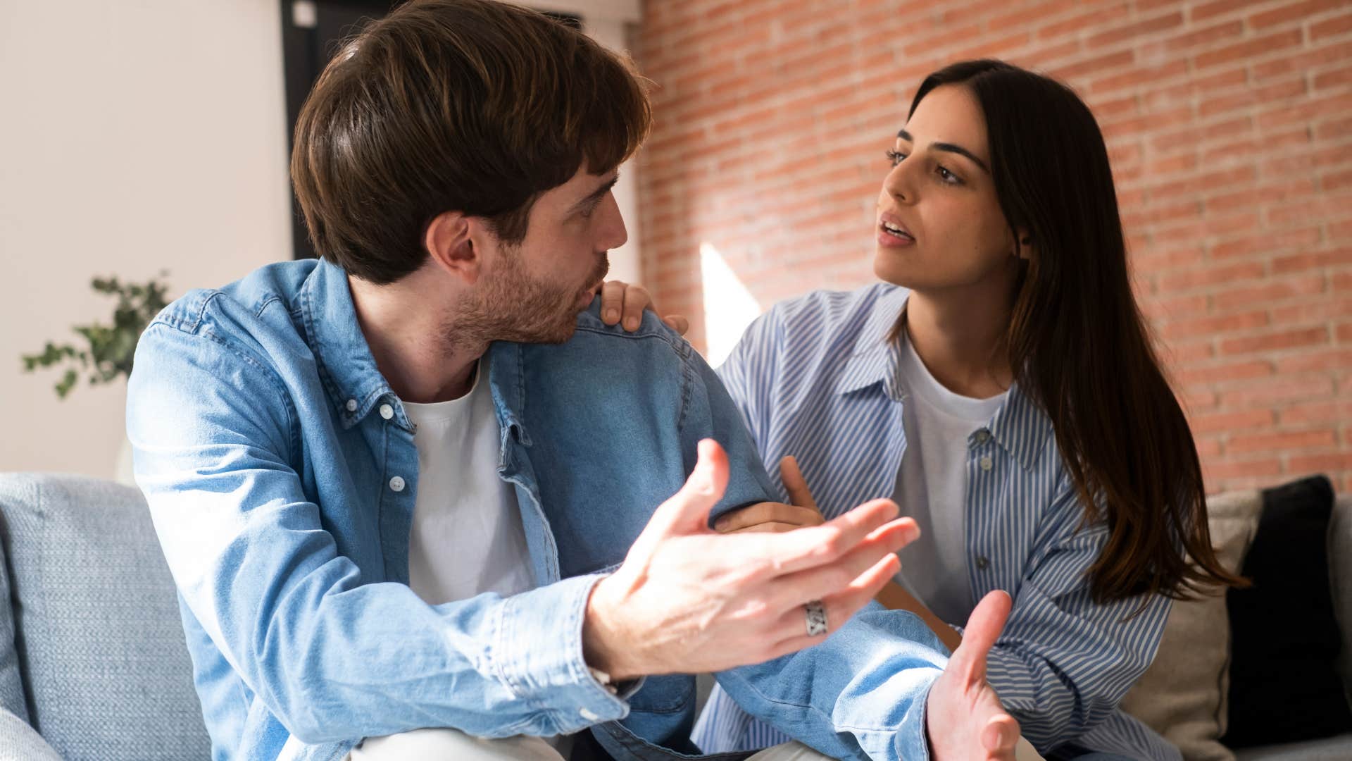 Couple having an argument on a couch