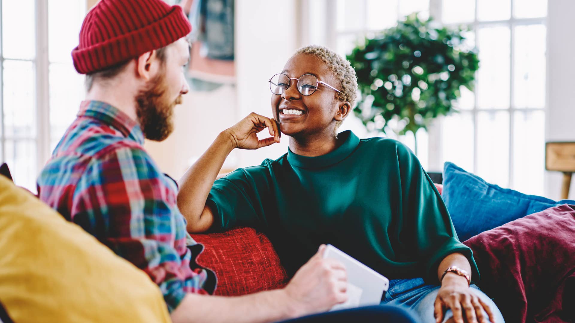 Woman smiling and talking to a man