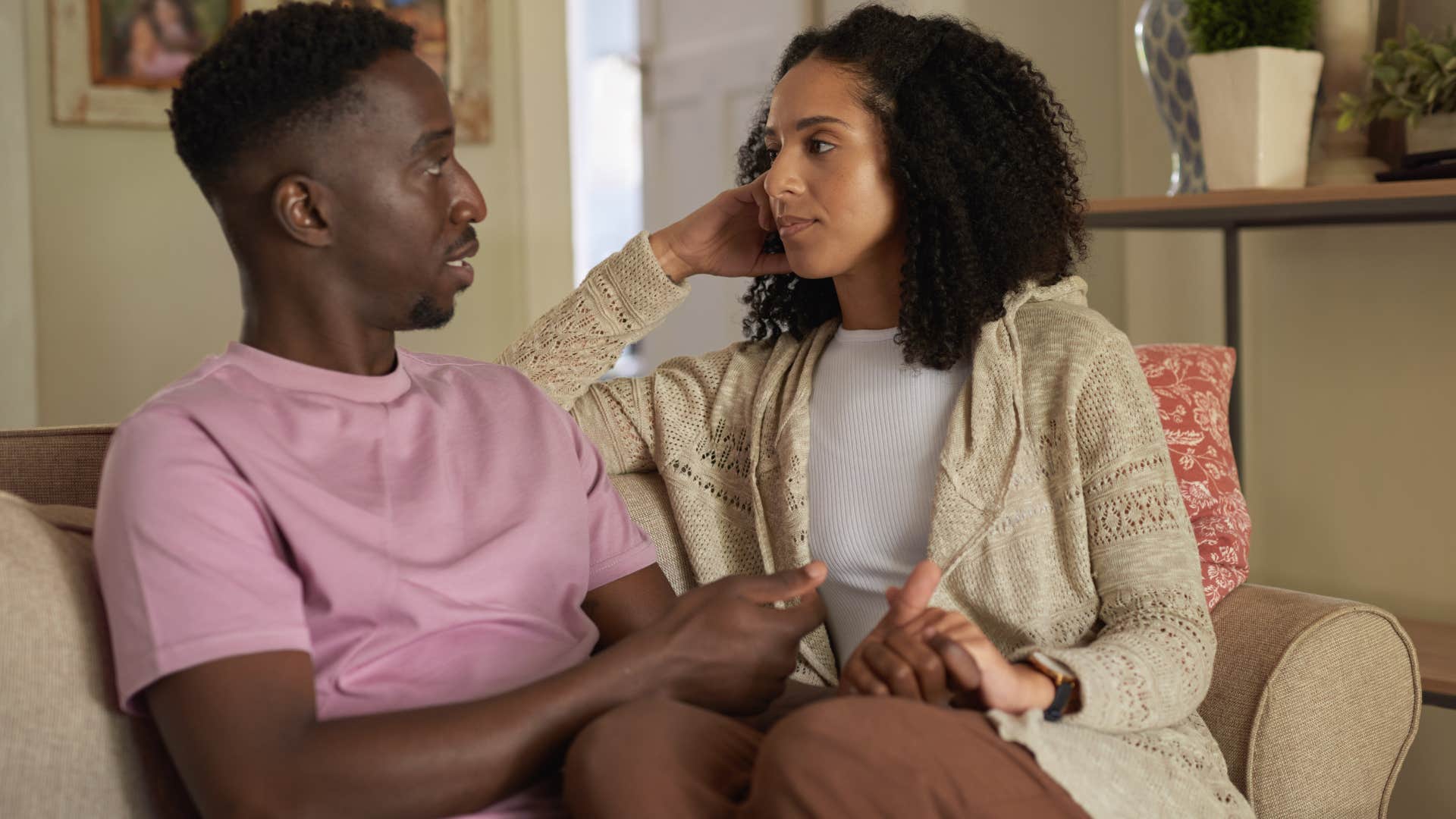 Couple having a serious conversation while holding hands