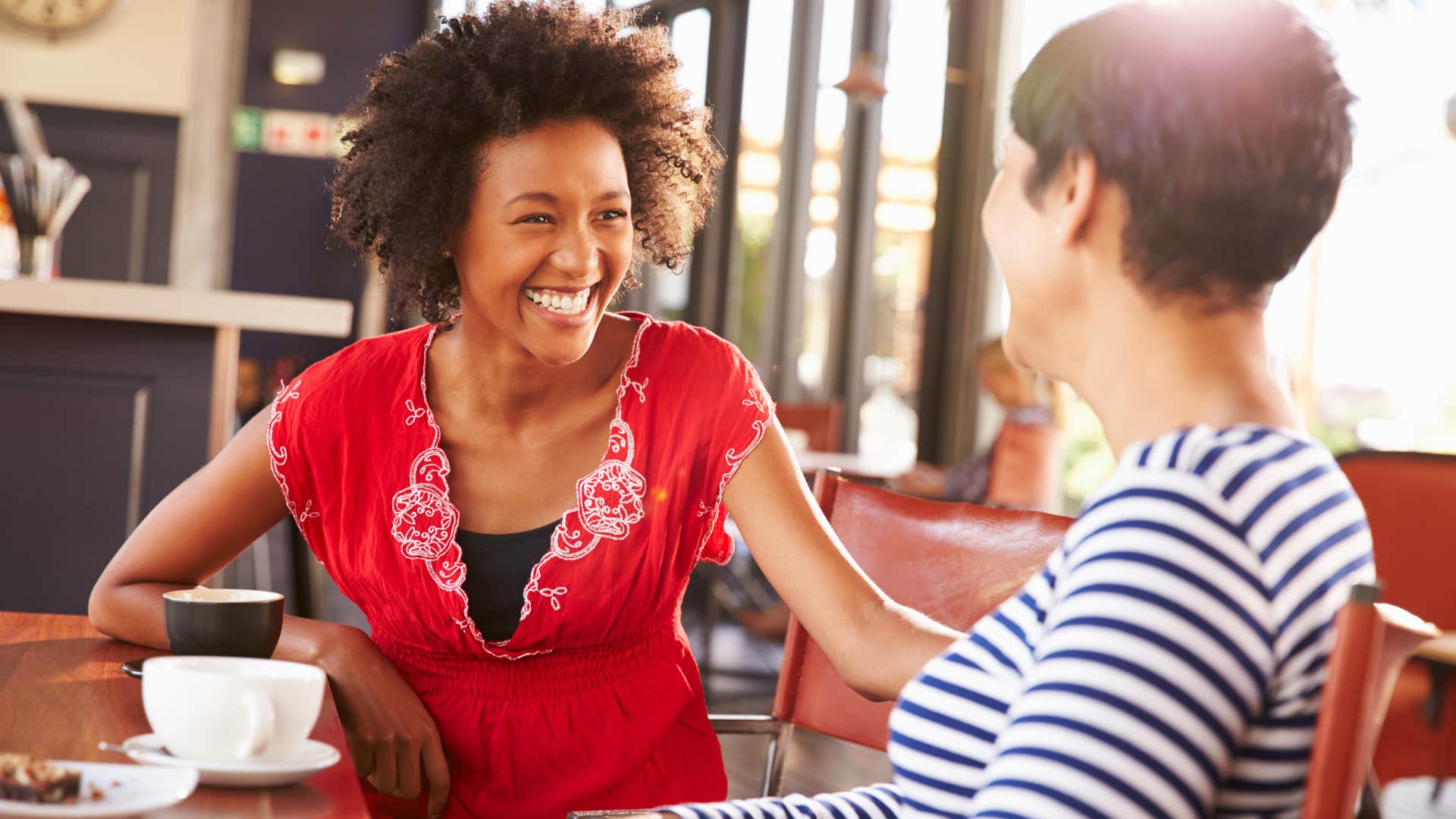 Woman smiling and talking to her friend