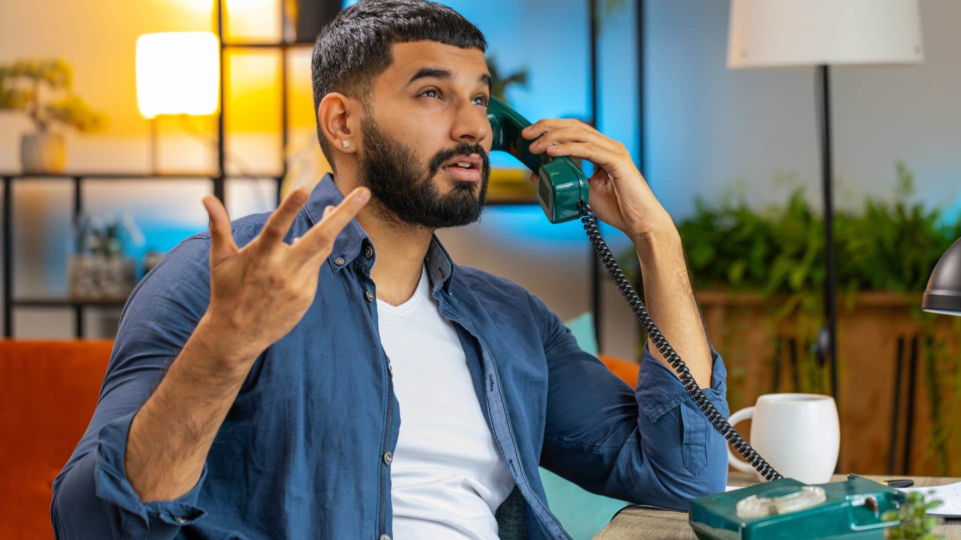 Upset man arguing with someone on the phone.