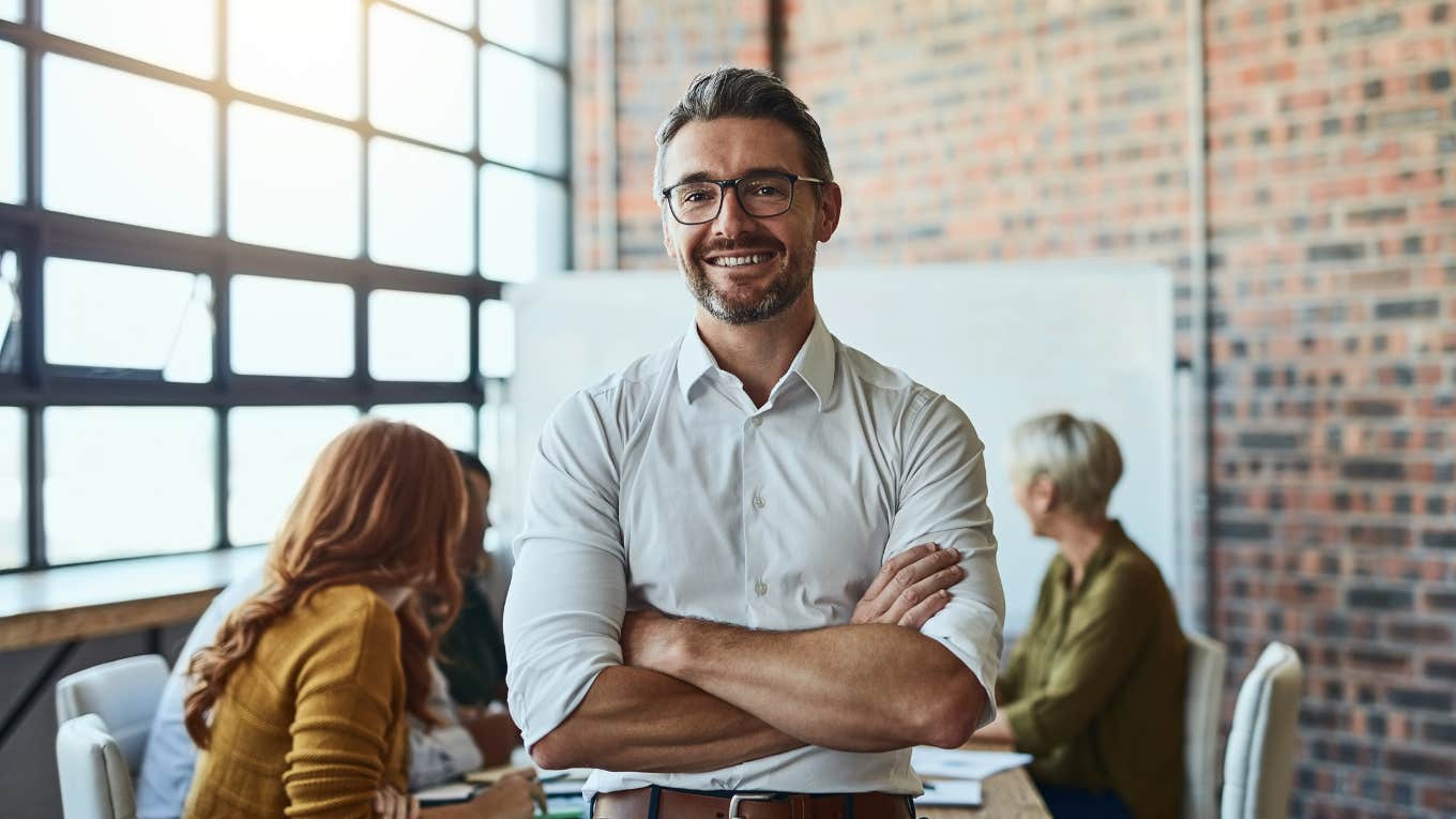 CEO smiling in meeting room