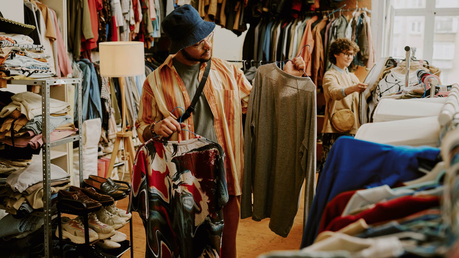 intelligent woman looking through a collection of clothes