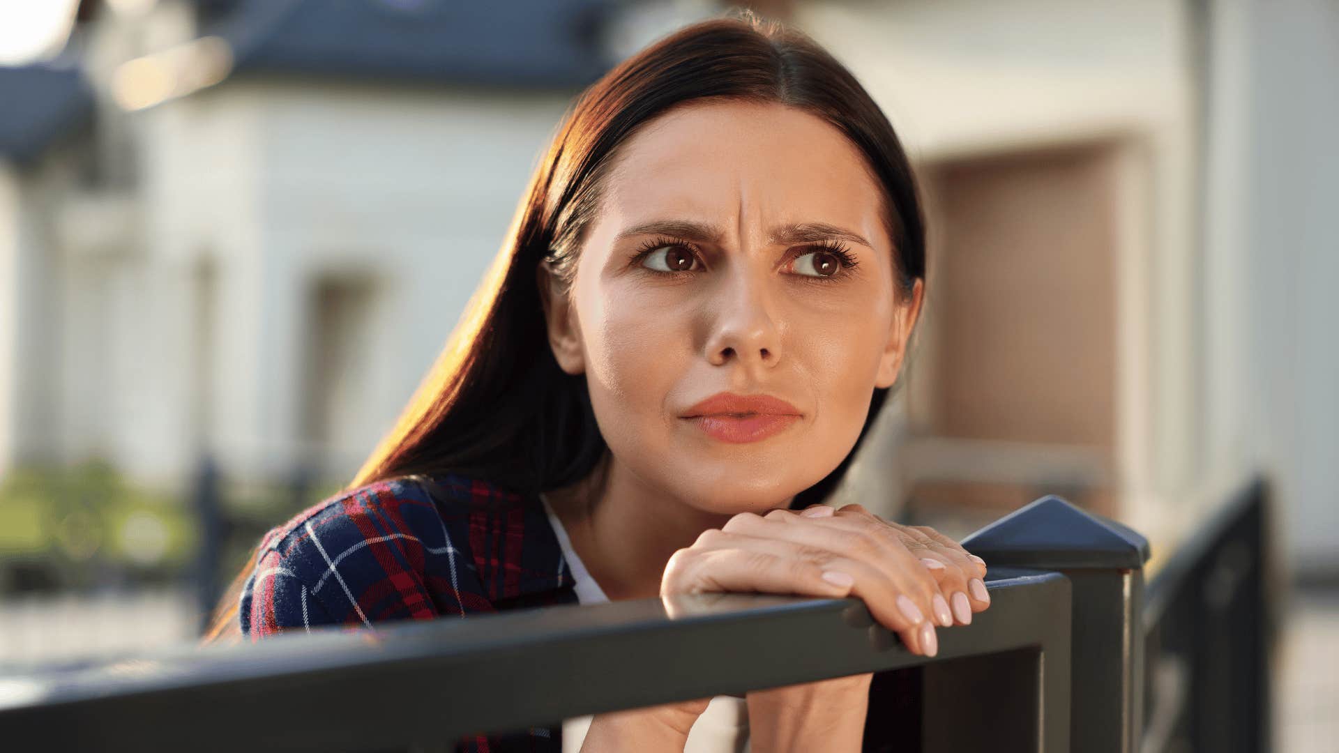 woman looking at something with a questioning gaze