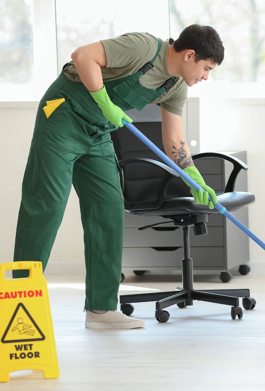 man working as a janitor in an office building