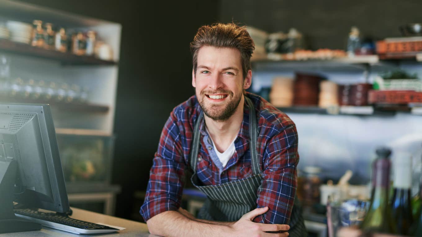 barista smiling at counter