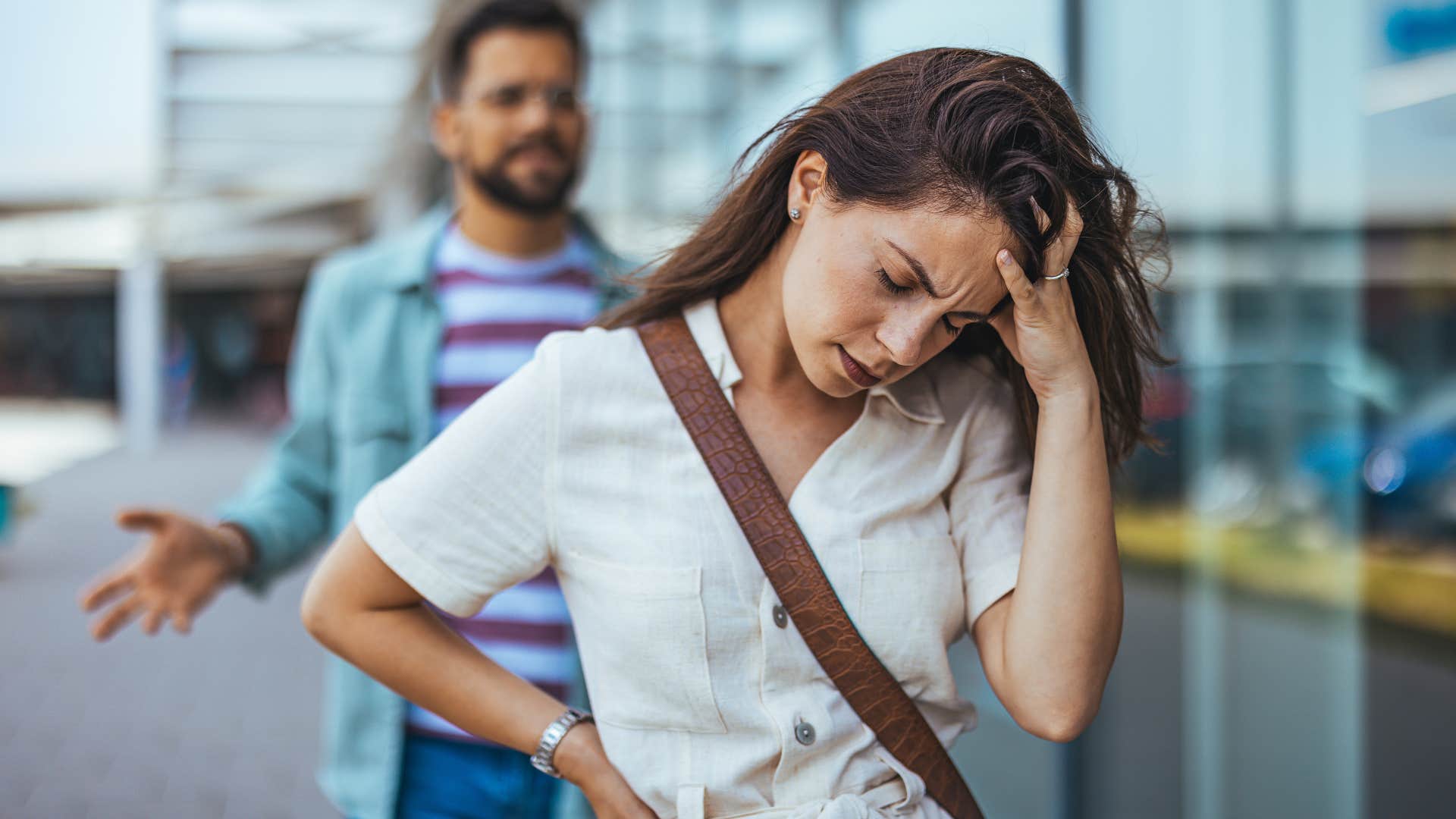 Woman turned away from her upset partner.