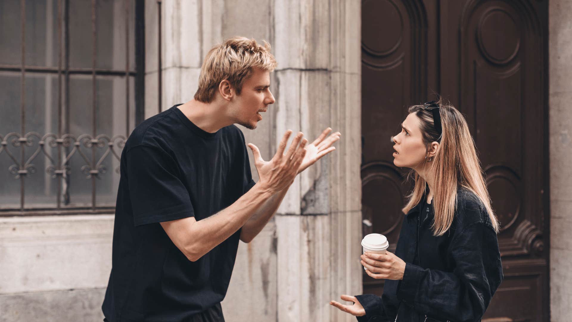 man yelling at woman outside