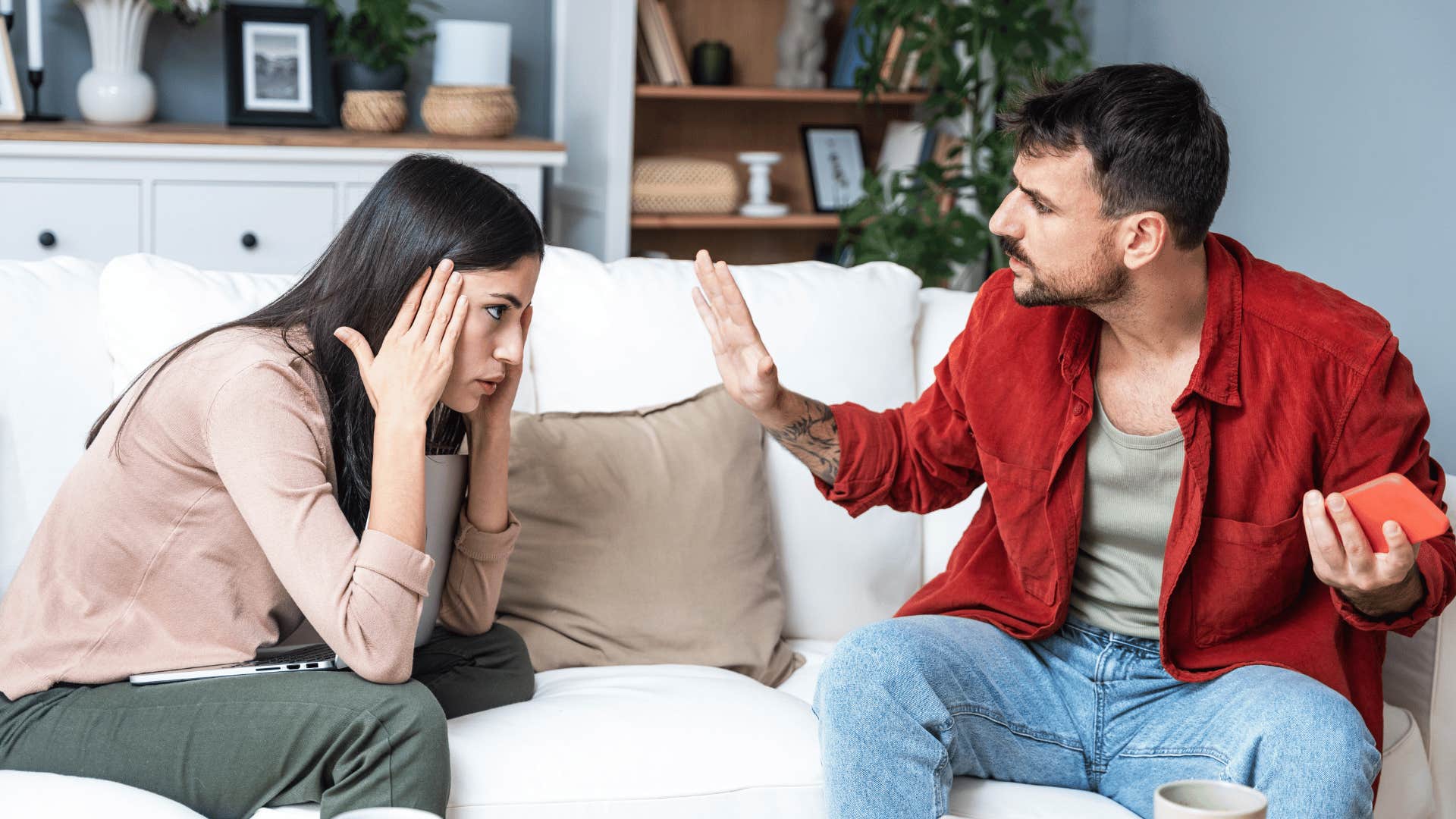 couple arguing on couch