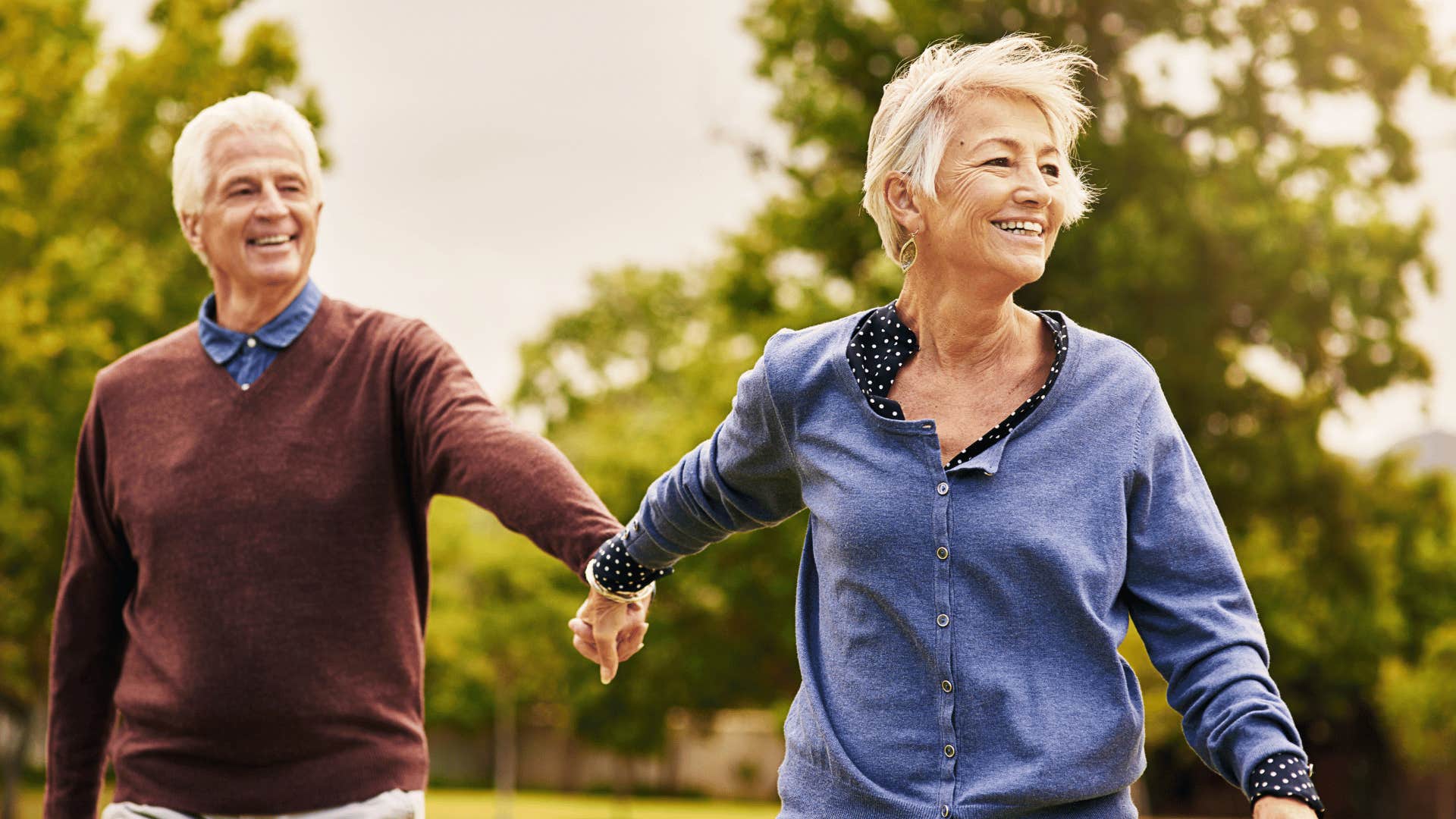 older couple holding hands