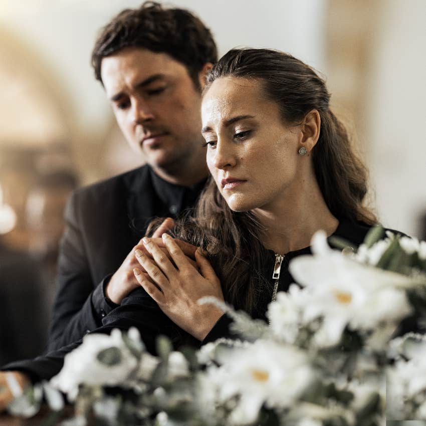 Grieving couple at a funeral