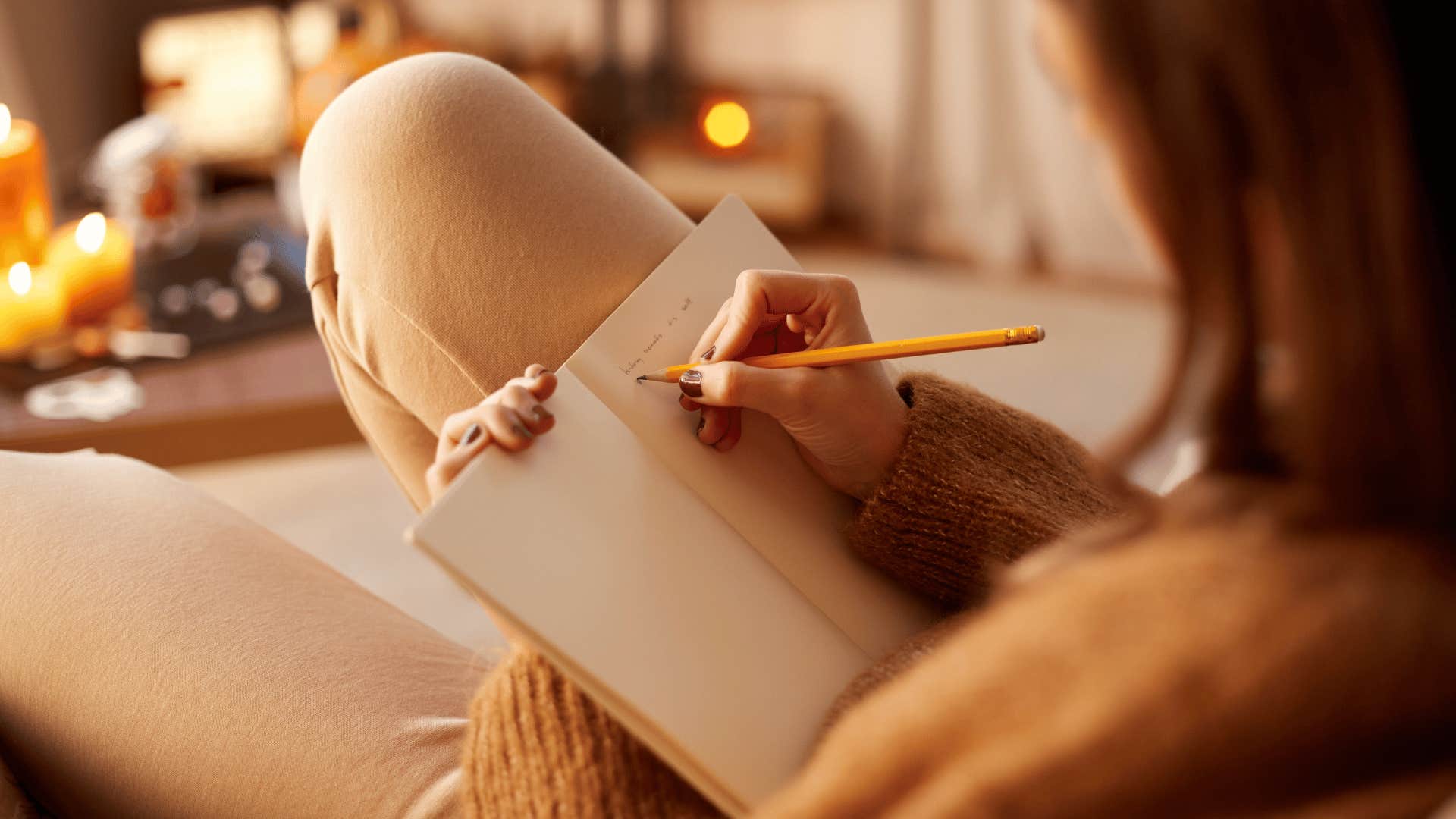 woman writing in journal