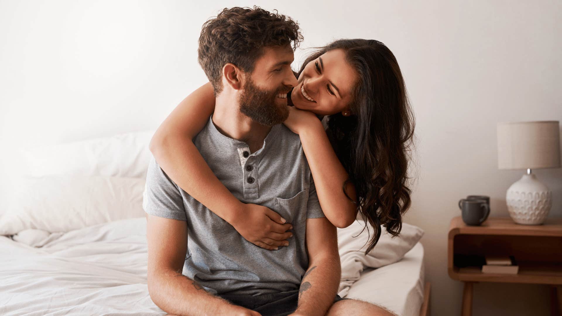 happy couple on bed