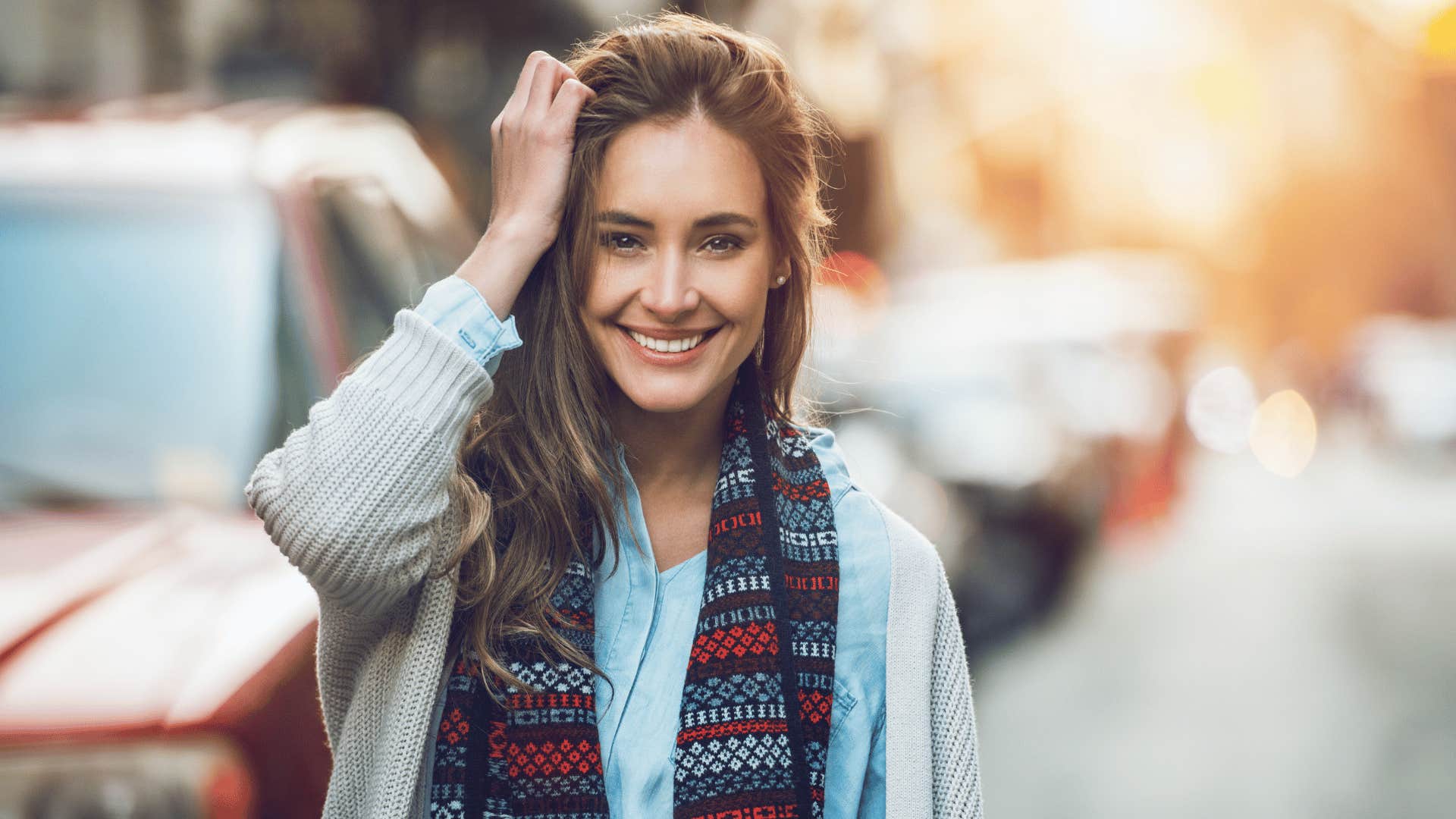 smiling woman walking outside