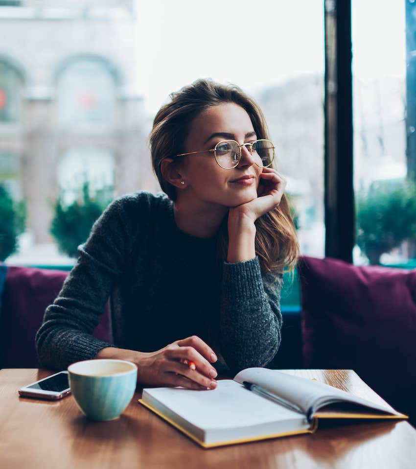 Woman reading self help guide book