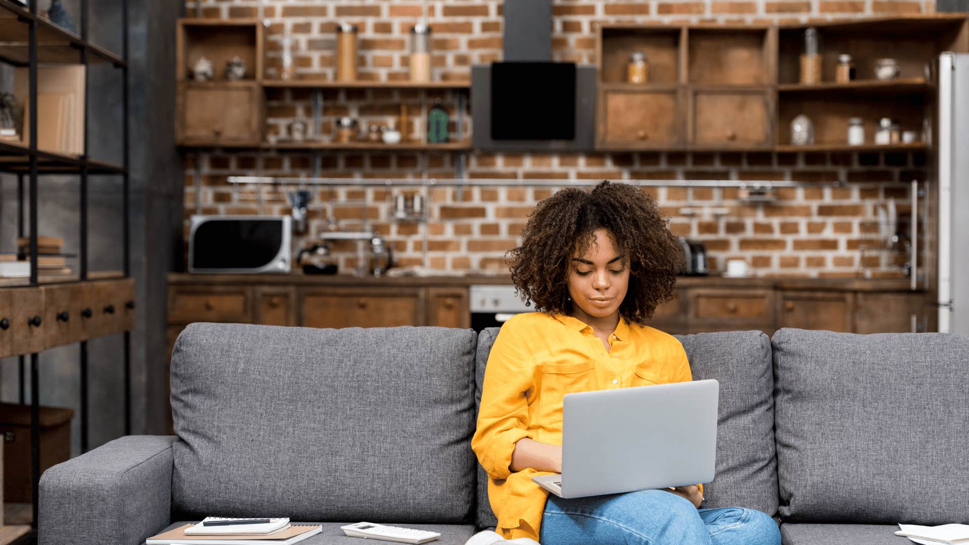 woman on laptop on couch