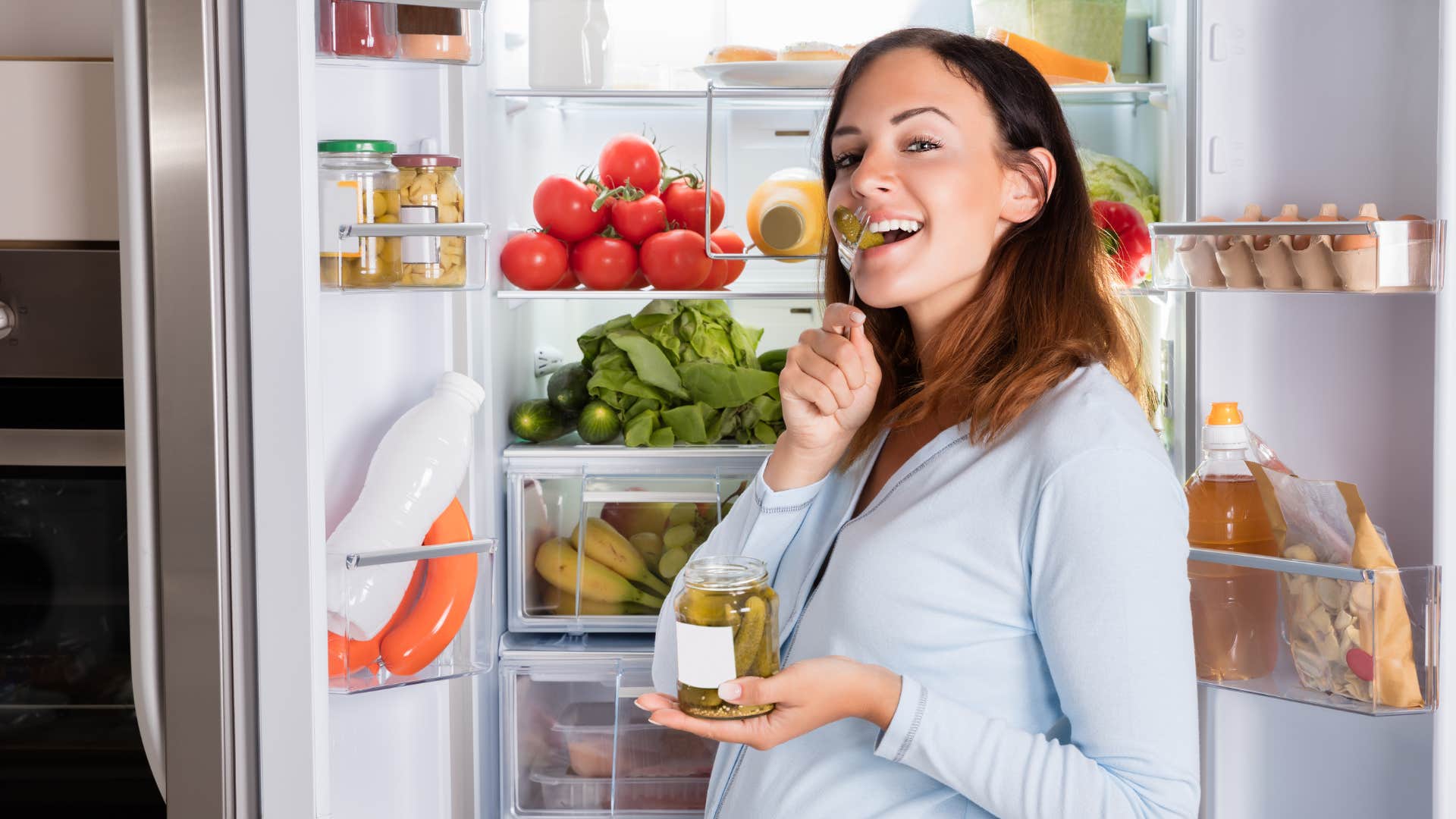 Pregnant Woman Eating Pickle