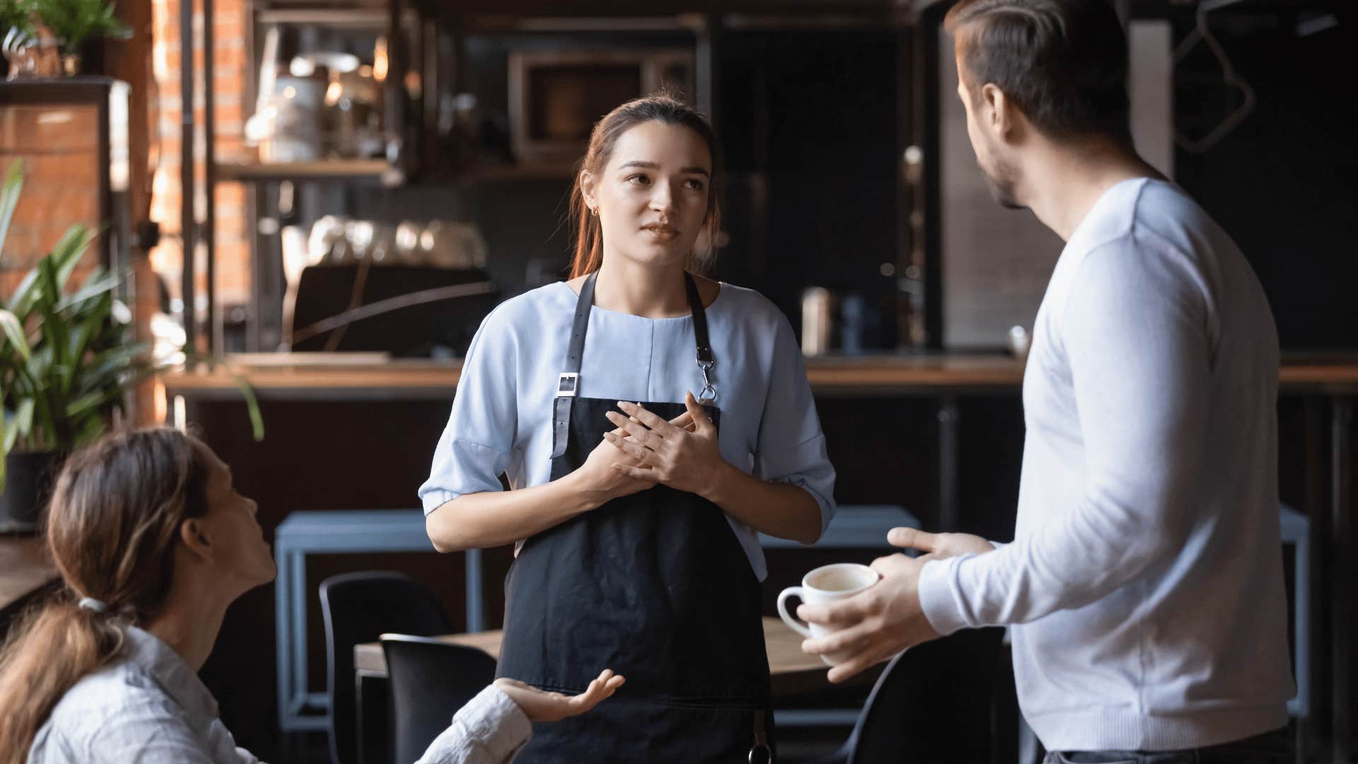 man yelling at waitress