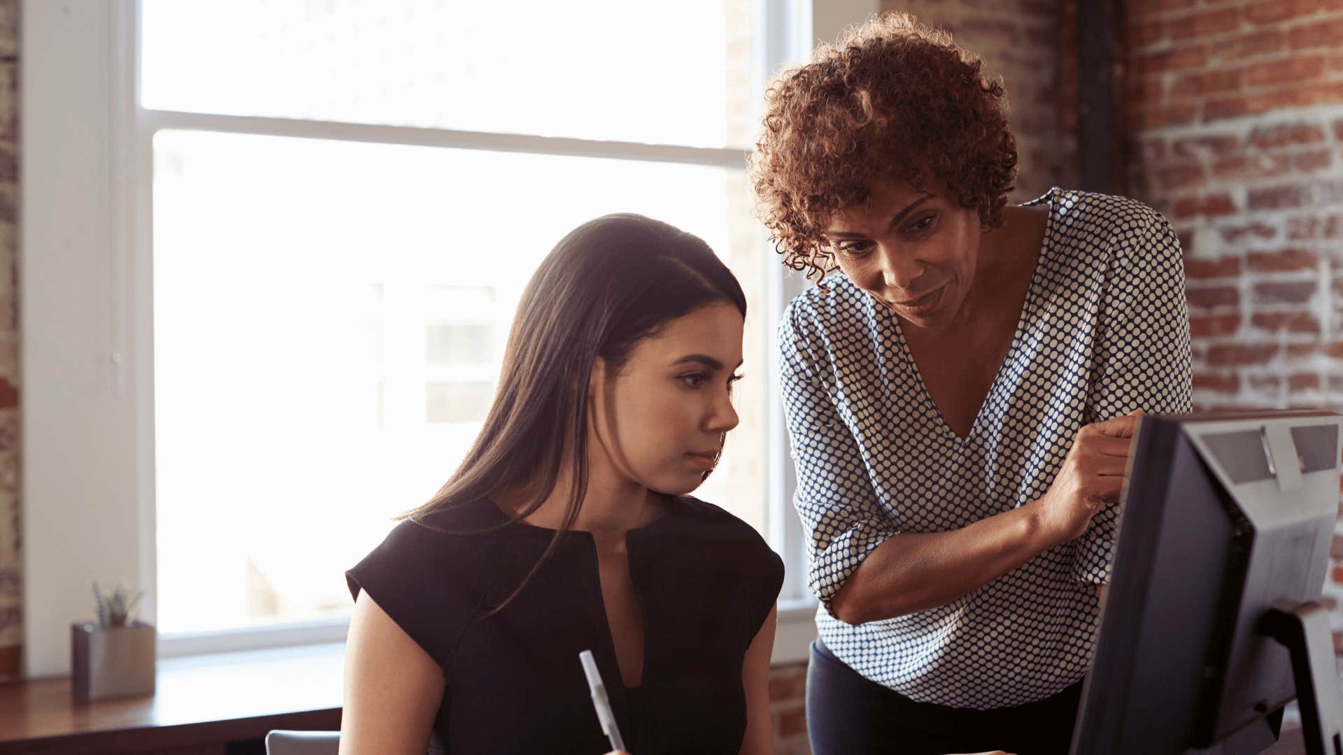 woman mentoring a protege