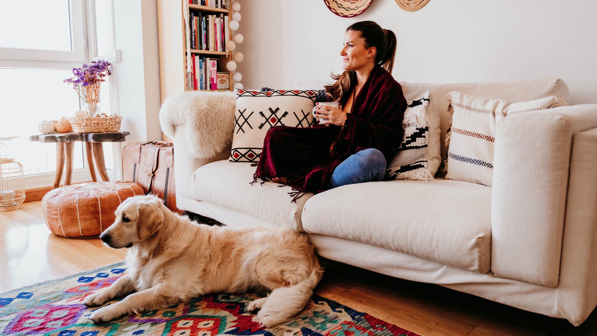 woman at home with her dog loving being alive