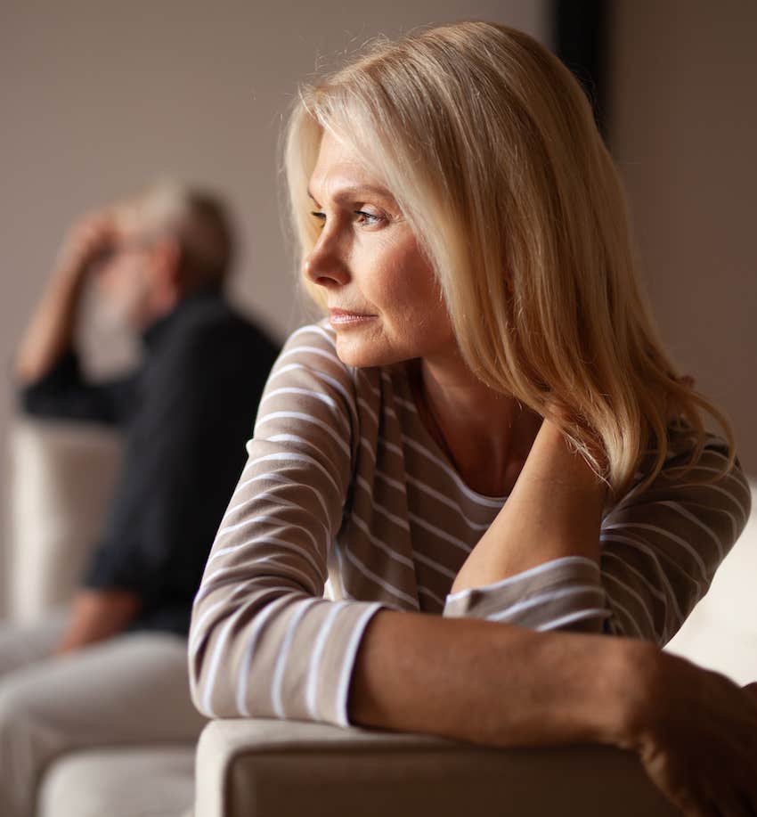 Tense woman turns back to moody man