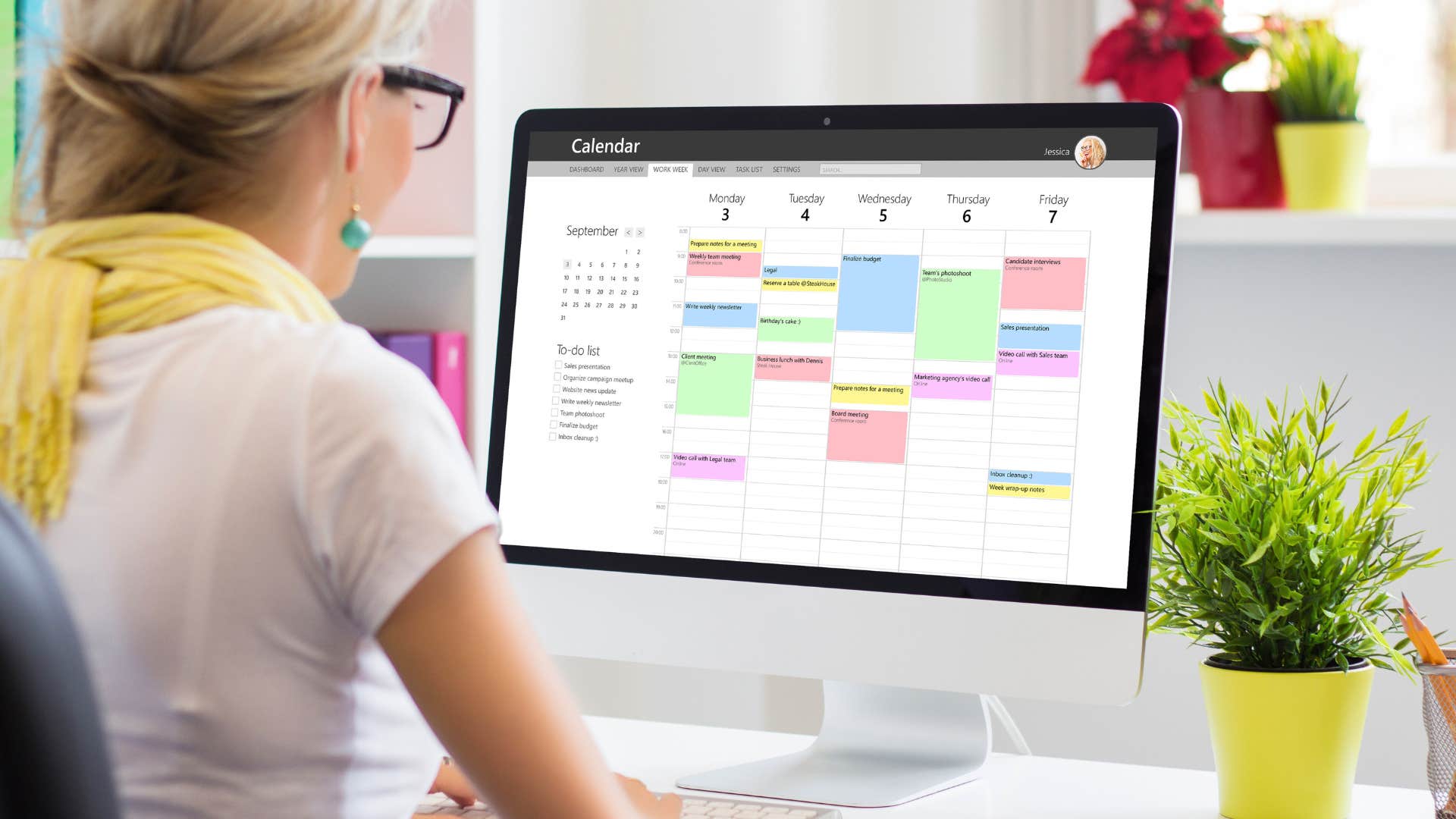 woman managing her schedule on a computer