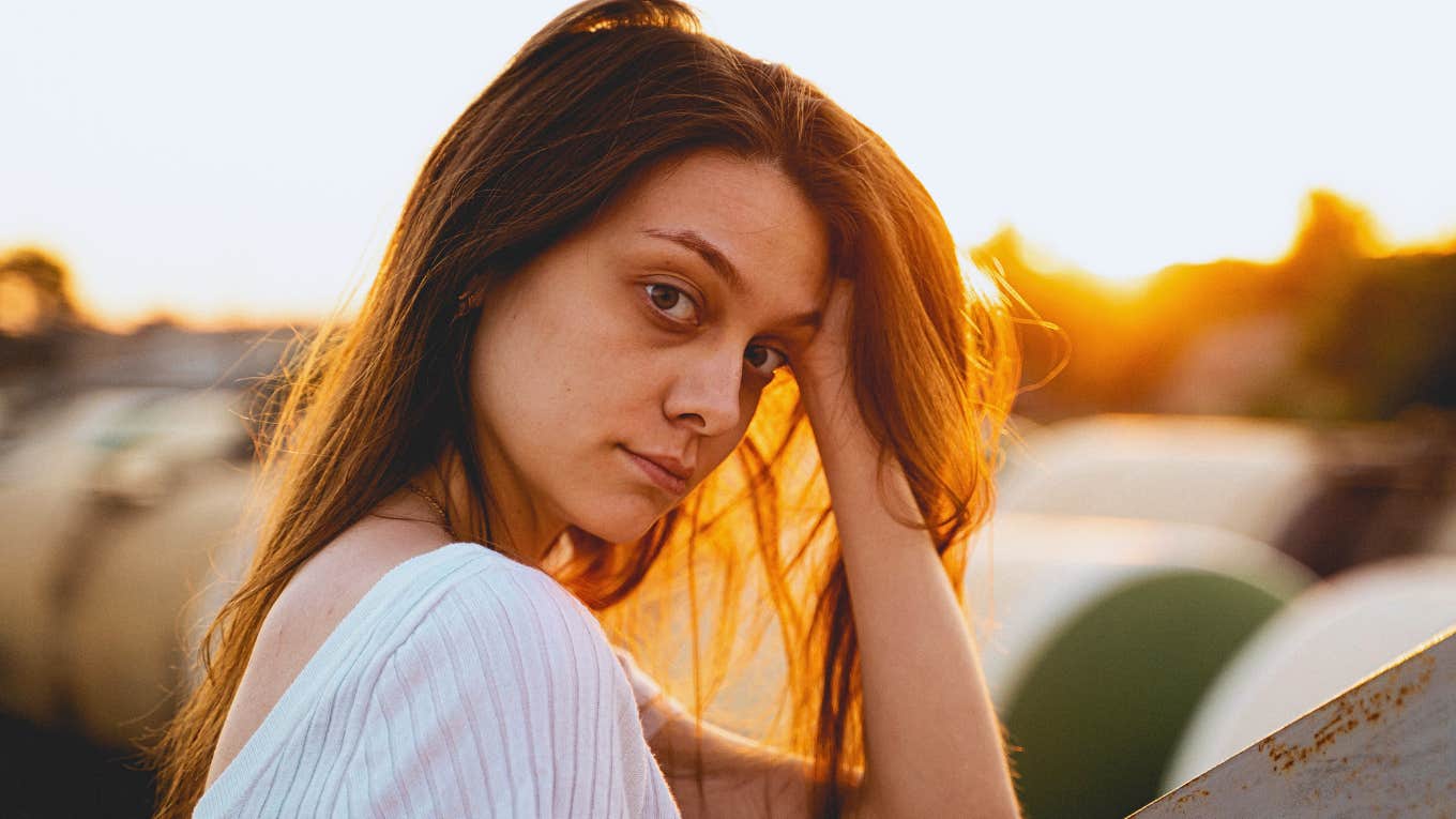 concerned woman holding her head in her hands