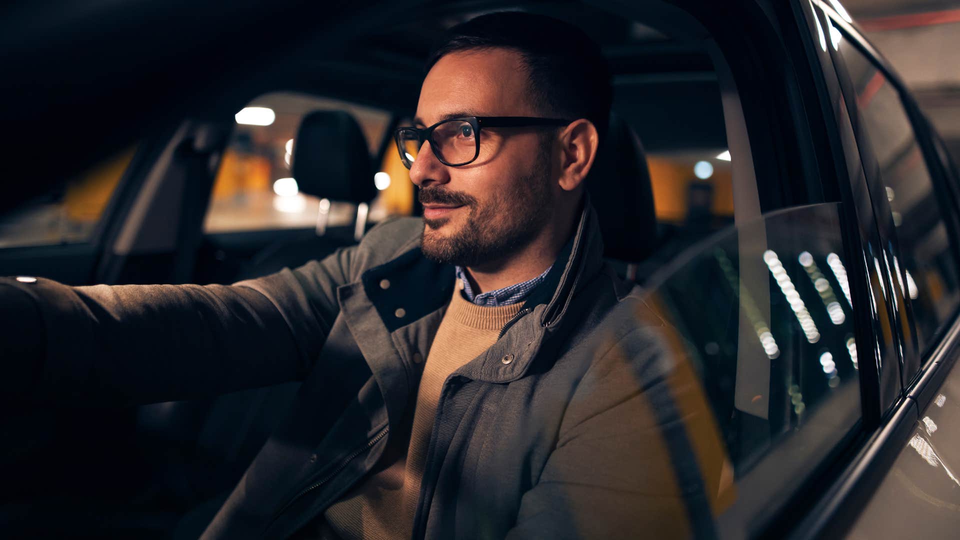 Man driving to work in his car.