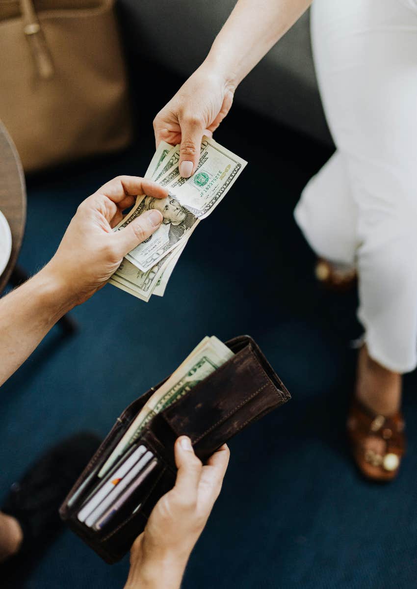 two people exchanging money