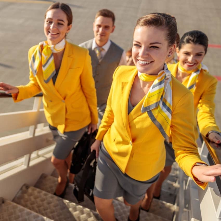 flight attendants walking on plane 