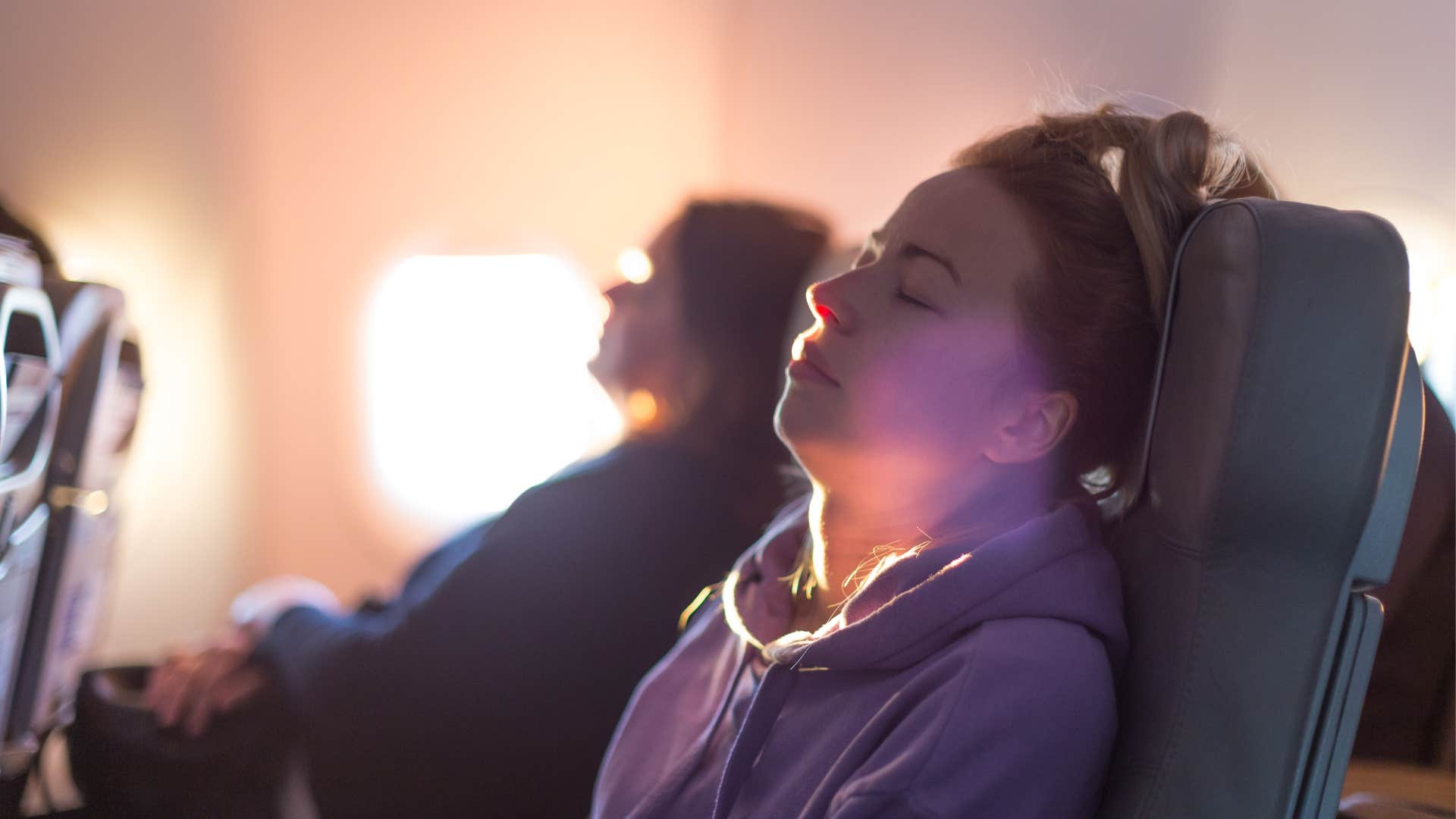 Women, sleeping, plane