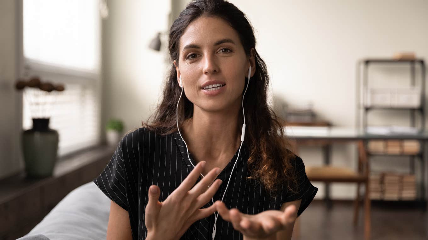 Woman smiling and talking with her hands.