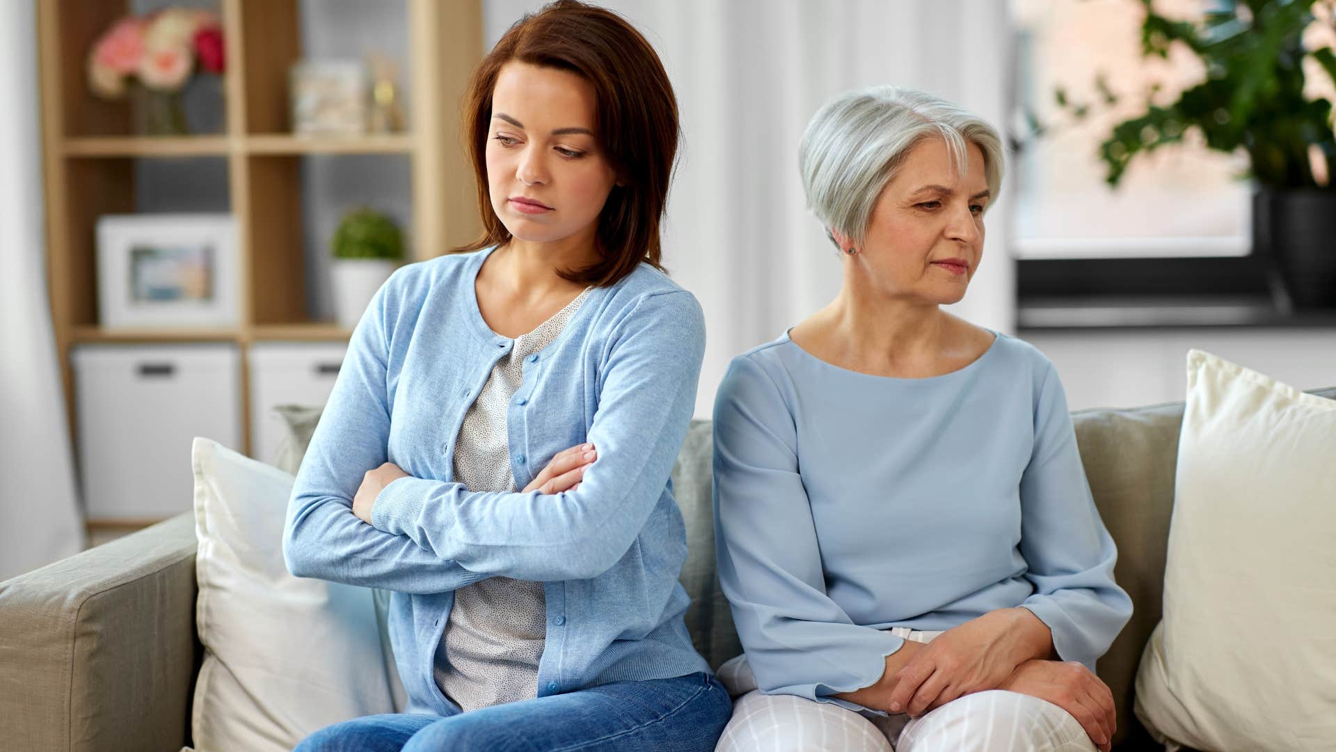 Woman turned away from her mother on the couch.