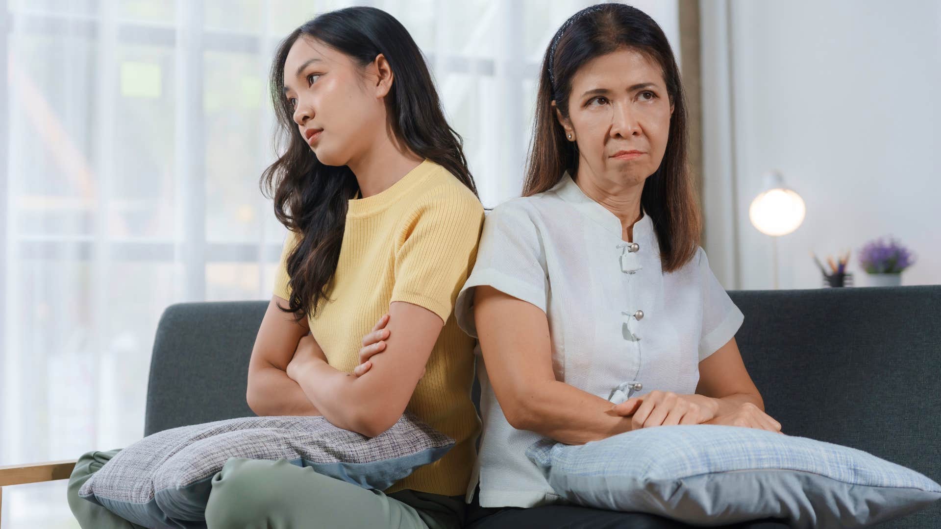 Woman turned away from her upset mother.