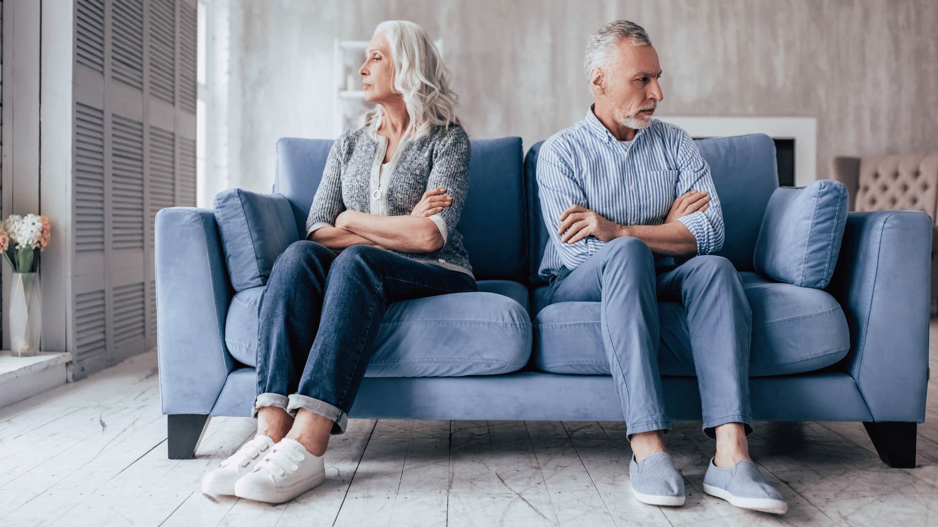 Defensive couple on couch tries to not go to bed angry