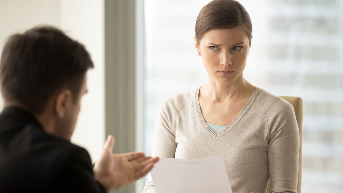 woman rejecting a job offer after being told of the low salary