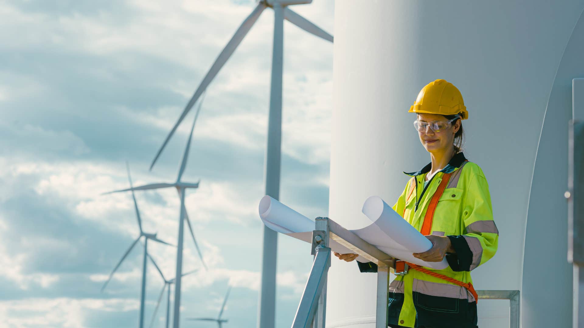 engineer studying plans for renewable energy