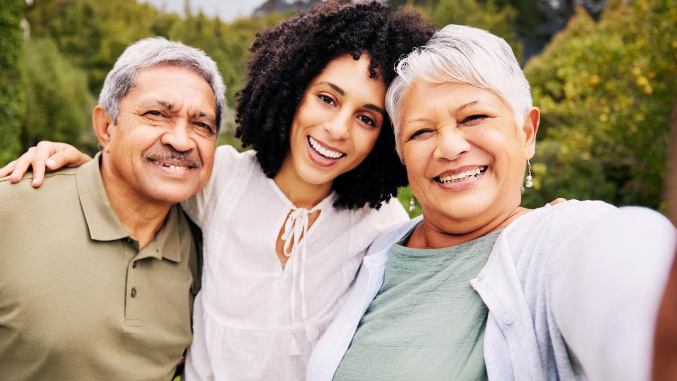 Strong adult woman, with her parents. 