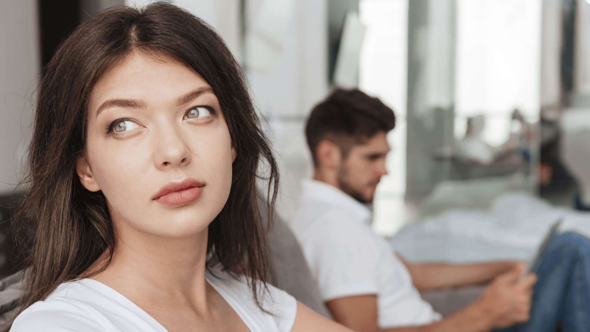 Man ignores introspective woman who has given up