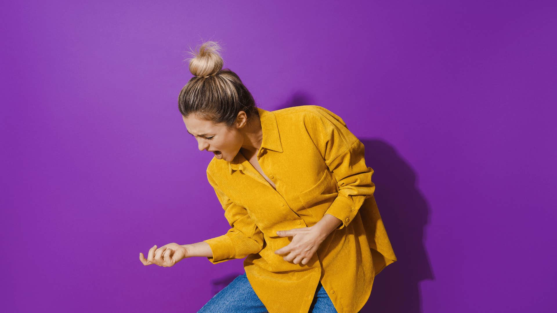 woman playing air guitar