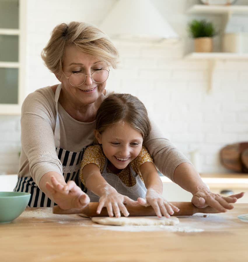 Fulfilled grandma cooking with her granddaughter