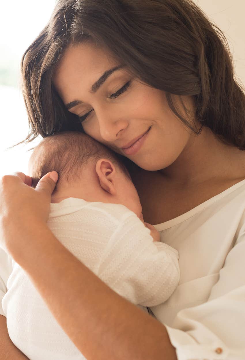 Happy mom holding her baby