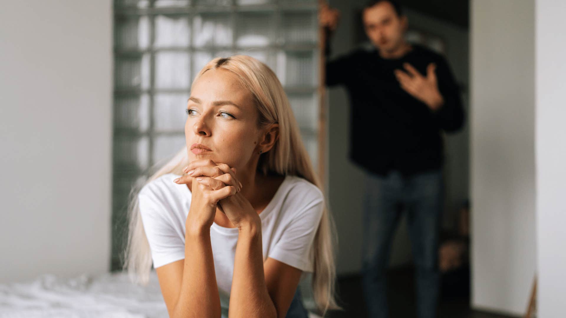 woman ignoring man yelling at her