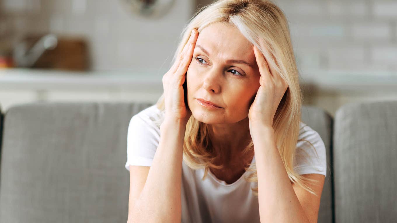 Woman with no enthusiasm thinking of friend's upcoming wedding. 