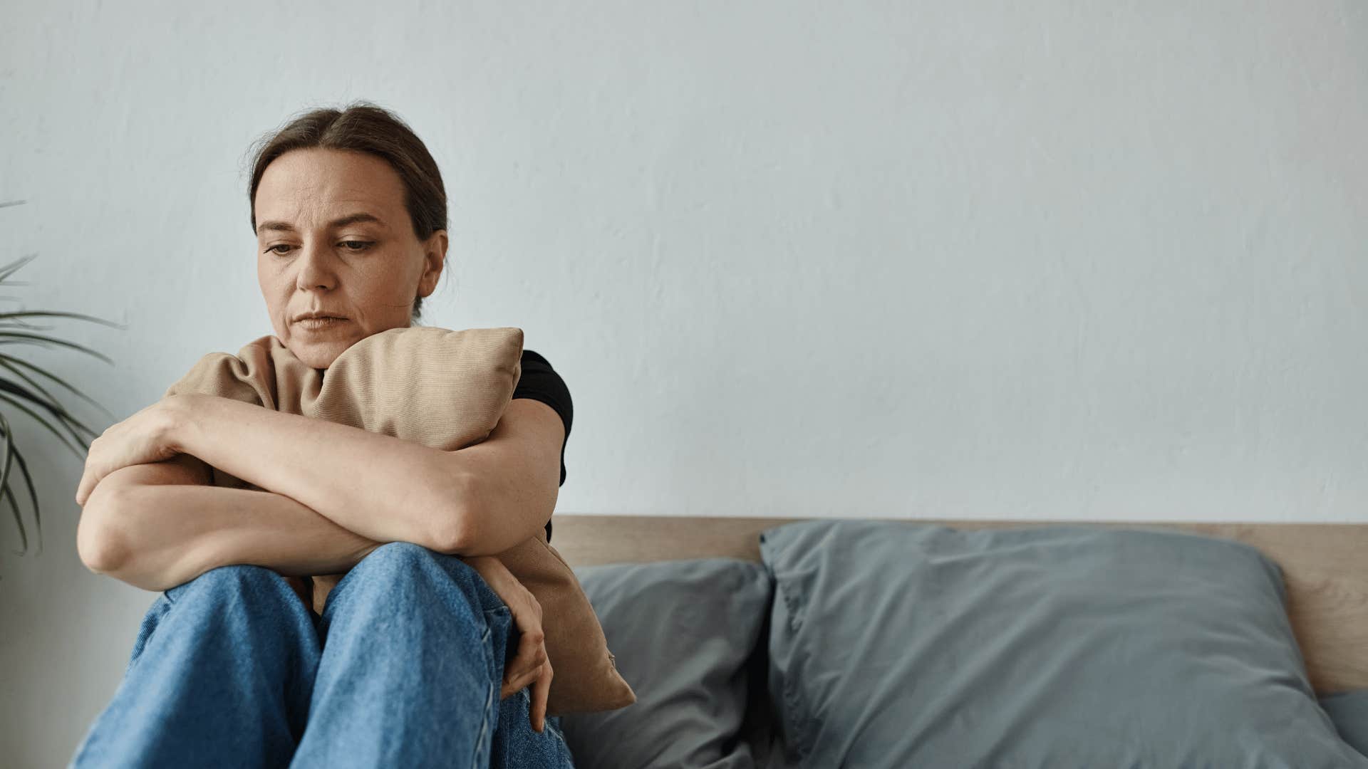 upset woman on couch