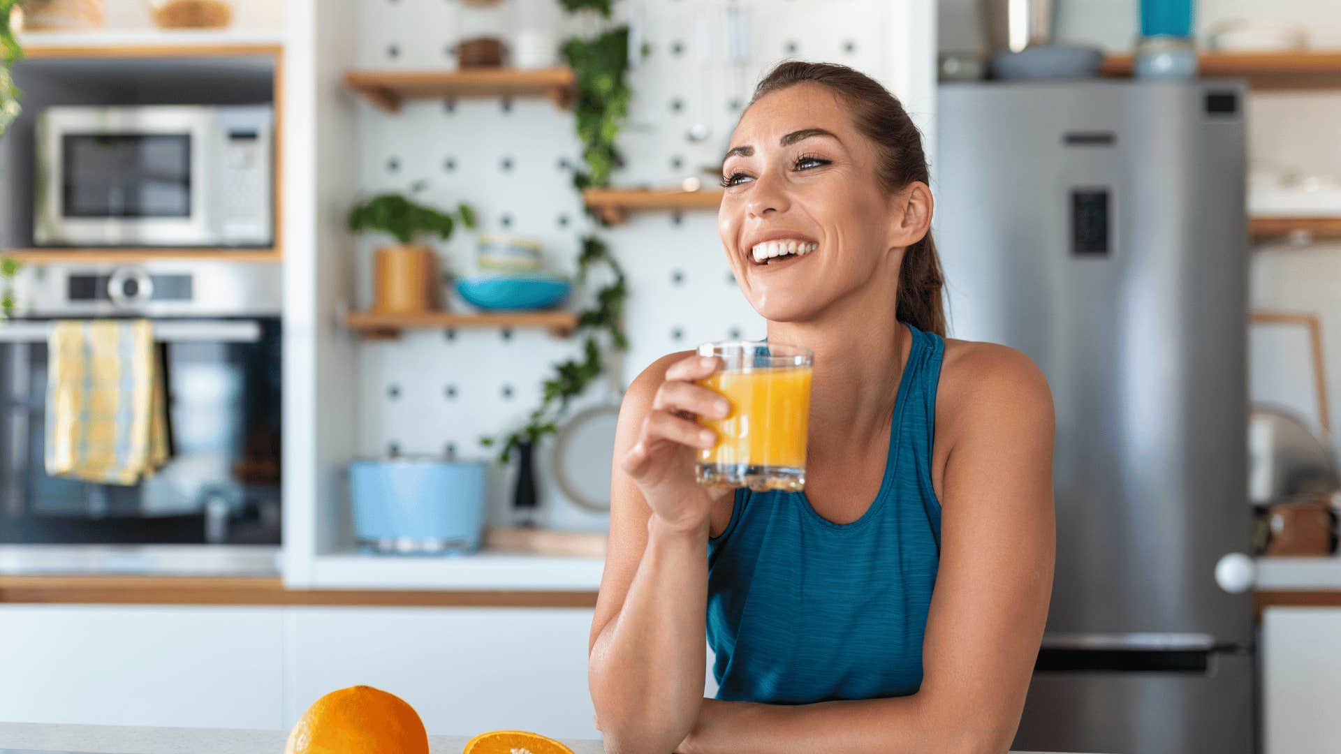 woman drinking orange juice